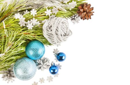 New Year Christmas composition with fir tree branch and cones with blue balls and tinsel isolated on white backgroundの写真素材