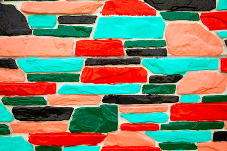 Multicolor green and red brick wall background