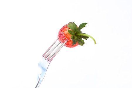 Fresh Stawberry and Fork on white  Background.の写真素材