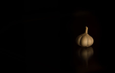 Garlic  on Dark tone Background Still lifeの写真素材