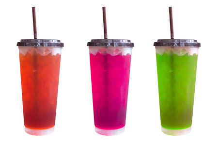 fresh sweet water colourful bright and ice in plastic glass isolated on white background,Summer drinks with ice on white backgroundの写真素材