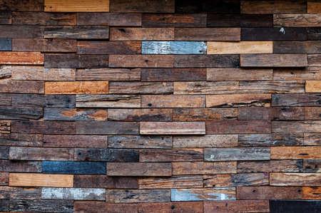 exposed wooden wall exterior, patchwork of raw wood forming a beautiful parquet wood pattern,Wood wall patternの写真素材