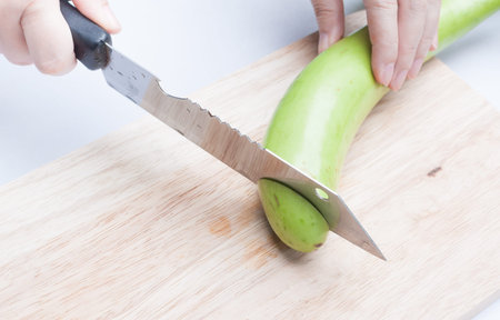 resh green eggplant sliced on wooden boardの写真素材