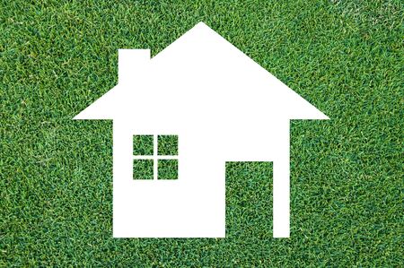white house icon on grass texture background,Eco Architecture,Green Building,Image clean green house. Ecologyの写真素材