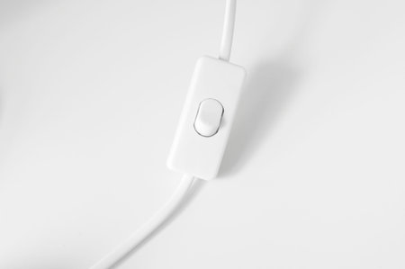 lighting switch under the white background , selective focus