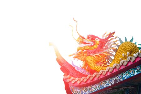 Dargon statue on Shrine roof on white background,dragon statue on china temple roof as asian artの写真素材