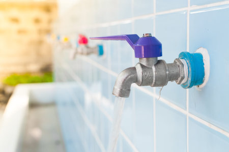 Open faucet Colorful Faucet on a blue wall