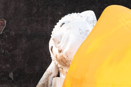 Buddha statues in at Wat Yai Chaimongkol in Ayutthaya Thailand, in Ayutthaya historical park, which is recognized as a unesco world heritage siteの写真素材