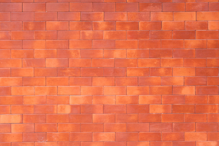 red brick wall background,Decorative red brick wall surface for backgroundの写真素材