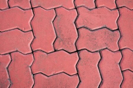 red cobblestone background,Stone paving texture. Abstract pavement backgroundの写真素材