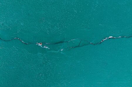 Old green Texture cracks Cement floor for backgroundの写真素材
