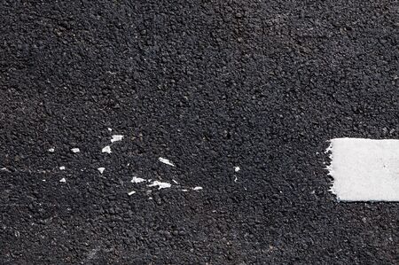 White line on new asphalt detail,Street with white line textureの写真素材