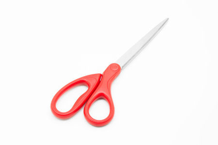 Red scissors on white backgroundの写真素材