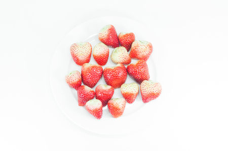 Top view Fruit, Fresh strawberry, berry red in white dish on white backgroundの写真素材