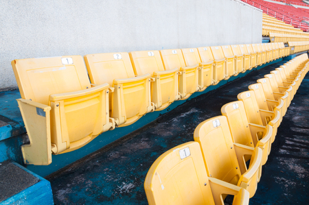 Empty yellow seats at stadium,Rows of seat on a soccer stadium,select focusのeditorial素材