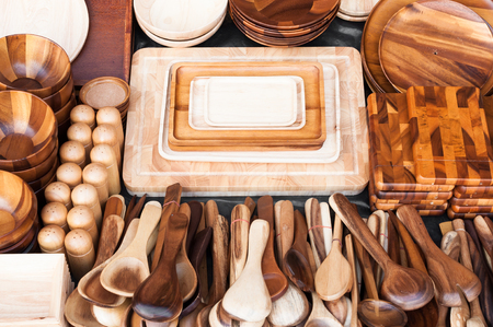 Wooden kitchen utensils at street market in thailandの写真素材