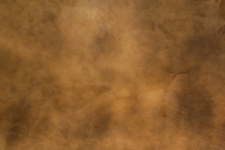 Texture of a orange brown concrete as a background, brown grungy wall - Great textures for backgroundの写真素材