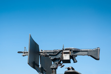 gun weapons,machine gun on blue skyの写真素材