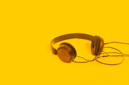 Headphones on yellow backgroundの写真素材