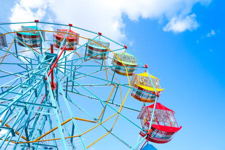 Ferris wheel on the background of blue sky,Colourful Vintage Ferris wheelの写真素材