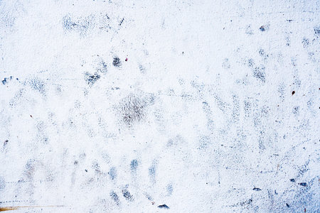 Dirty black painted stains on white cement wall texture