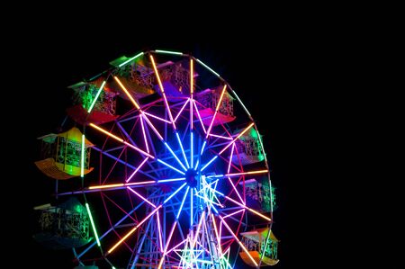 Colourful Ferris wheel on a beautiful night,Colourful Vintage Ferris wheelの写真素材