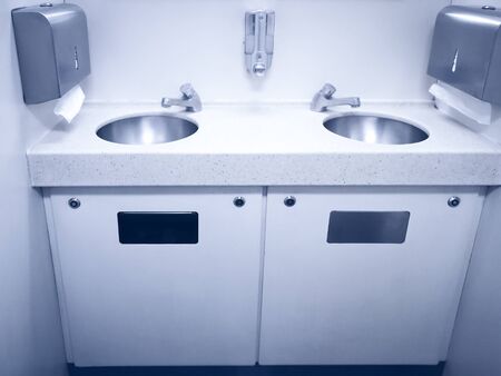 Sink wash hands and toilet paper clean of the train in a fast modern trainの写真素材
