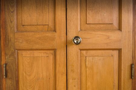 Lock on wood door,wood door entrance of residential houseの写真素材