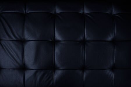 Horizontal elegant black leather texture with buttons for pattern and background.Genuine leather upholstery background for a luxury decoration in Black tonesの写真素材