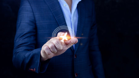 Businessman pointing finger to select flight by pressing touch screen airplane button,Business Airplane transportation conceptの写真素材