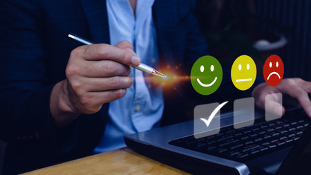 Businessman choosing happy smile face icon. feedback rating and positive customer review experience, satisfaction survey. mental health assessment. World mental health day conceptの写真素材