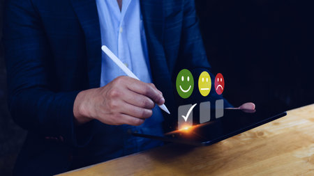 Businessman choosing happy smile face icon. feedback rating and positive customer review experience, satisfaction survey. mental health assessment. World mental health day conceptの写真素材