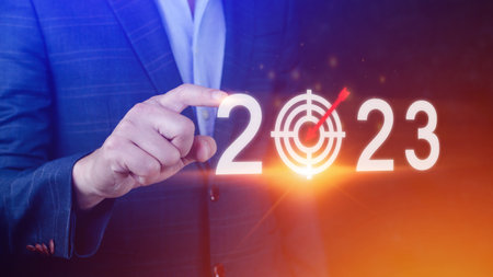 Business target and goal 2023 icon, hand pointing holding 2023 virtual screen, Start new year 2023 with a goal plan, action plan, strategy, new year business vision.の写真素材