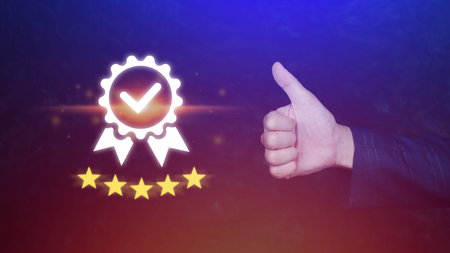 Businessman hand shows the symbol of the top service Quality assurance 5 star with thumb up ,...