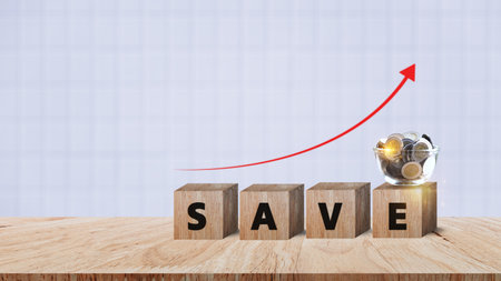 Wooden blocks with words save money Coins for investment loan planned future concept. saving, charity, family finance plan concept, fundraising, superannuation, financial crisis conceptの写真素材