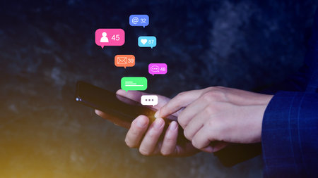 People using social media and digital online marketing concepts on mobile phones with icons such as...