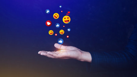 Social media and online digital concept, Businessman using  sending emojis with social media. People using and digital online marketing conceptsの写真素材