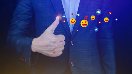 Social media and online digital concept, Businessman using  sending emojis with social media. People using and digital online marketing conceptsの写真素材
