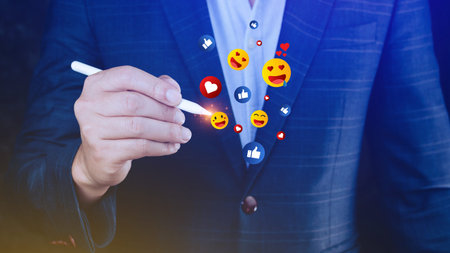 Social media and online digital concept, Businessman using  sending emojis with social media. People using and digital online marketing conceptsの写真素材