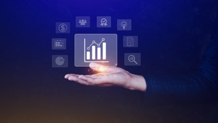 Big data analytics and business intelligence BI concept with chart and graph icons on digital screen interface and business people in the background.の写真素材