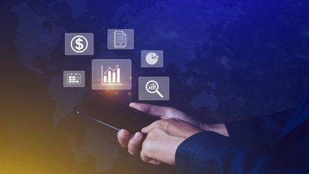Data analytics and business intelligence BI concept with chart and graph icons on digital screen interface on smartphone and business people in the background.の写真素材