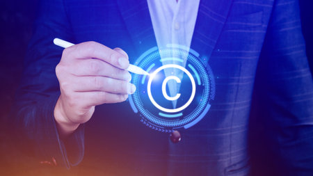 Businessman touching Copyright icon, patents and intellectual property protection law and rights with symbol of the copyright, copyright symbol from the author.の写真素材