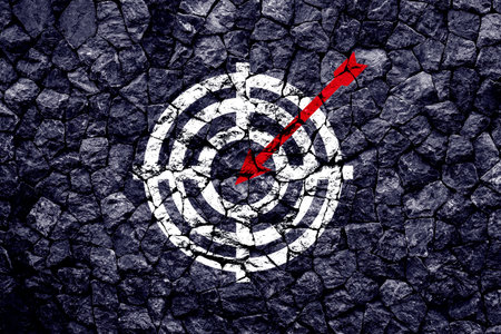 Target figure on broken wall, concept of achieving goal quality, Aim Target Red Symbols of goals and objectives over grunge background. business ideaの写真素材