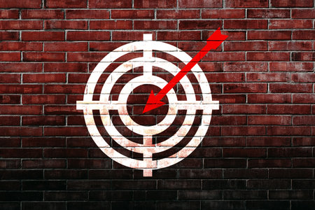 Target figure on brick wall, concept of achieving goal quality, Aim Target Red Symbols of goals and objectives over brick wall background. Business ideaの写真素材