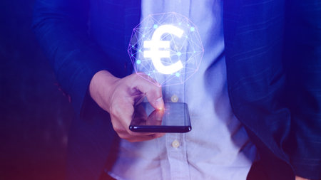 Businessman hands holding with Euro sign on global online networking virtual screen, Online banking currencies exchange financial concept.の写真素材