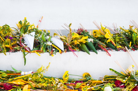 Thai traditional of flowers to Buddhist monks ceremony at  Wat che di Luang Chiang Mai, Thailand in the background there is incenses, candles and flowersの写真素材