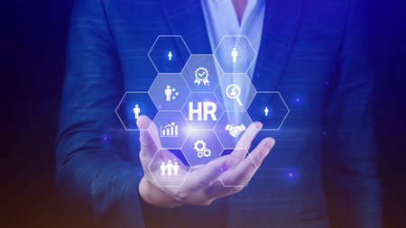 Businessman hand holding modern social human resources button, Human resources, HR management, employment, headhunting concept.の写真素材