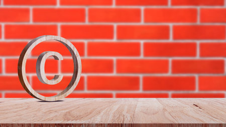 Copyright concept, author rights and patented intellectual property, Copyright Symbol Protection Sign on wooden table. Register Trademark and Logoの写真素材