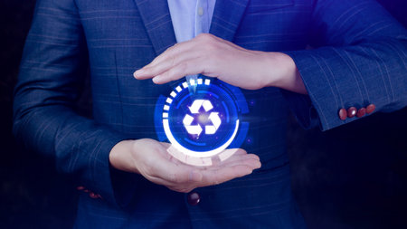 Businessman hand holding recycle icon concept in screen, for environmental, social and governance in sustainable and ethical business on the Network connection.の写真素材