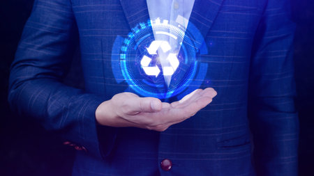 Businessman hand holding recycle icon concept in screen, for environmental, social and governance in sustainable and ethical business on the Network connection.の写真素材